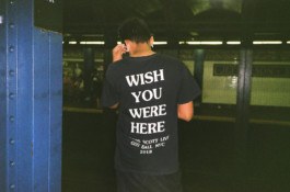  Man with a tshirt saying 'wish you were here'